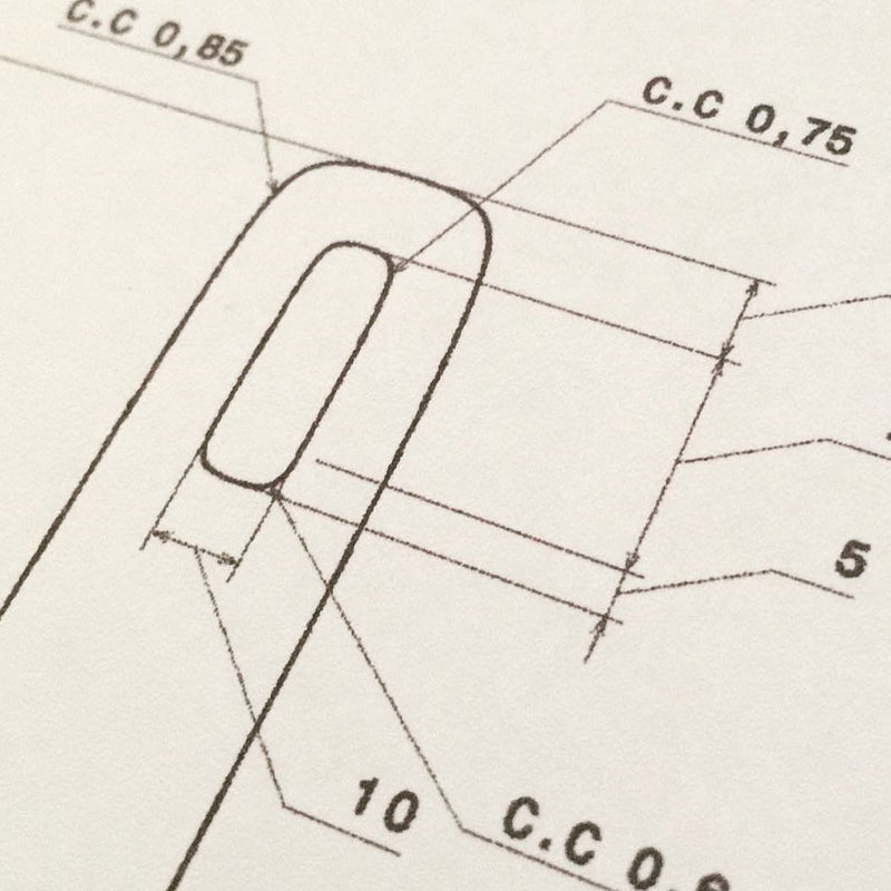 A close-up technical darto design drawing on a light background, showing a rounded rectangular outline with measurement annotations and labels such as C.C 0,85, C.